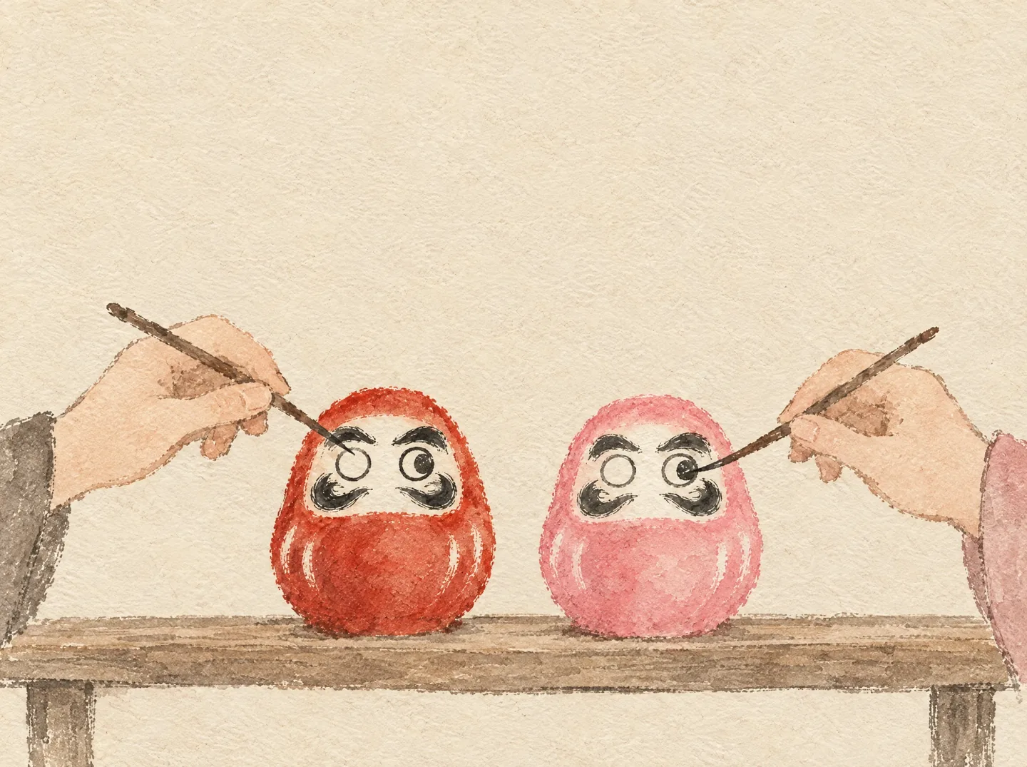 An ink and watercolor painting of two small Daruma, one red and one pink, on a wooden shelf, with a hand from each side painting an eye on each doll.